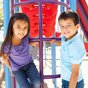 Boy and Girl on playground equipment.jpg